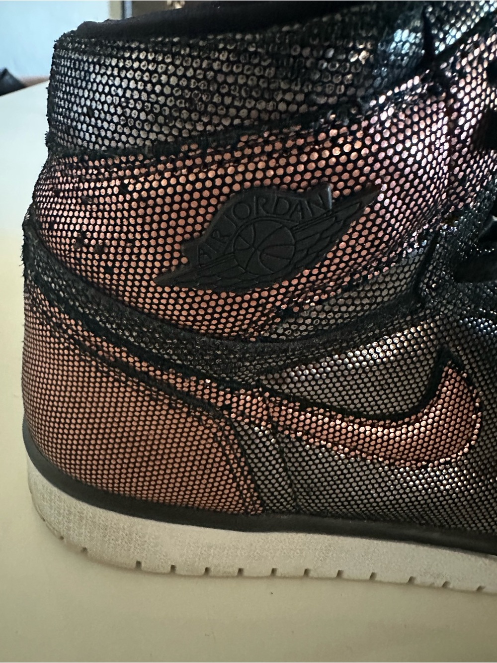 Jordan Women’s High-Top Sneaker in Metallic Rose and Black